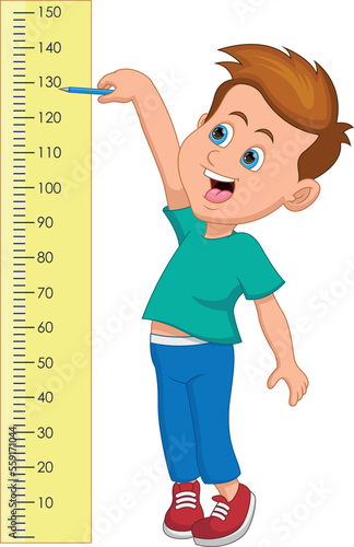 little boy measures his height