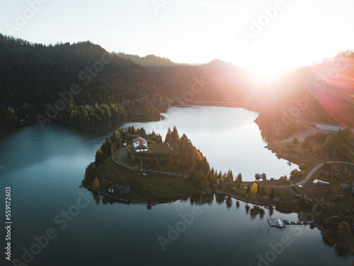 Aerial view of spectacular sunset over Lake Colibita, Bistrita Nasaud