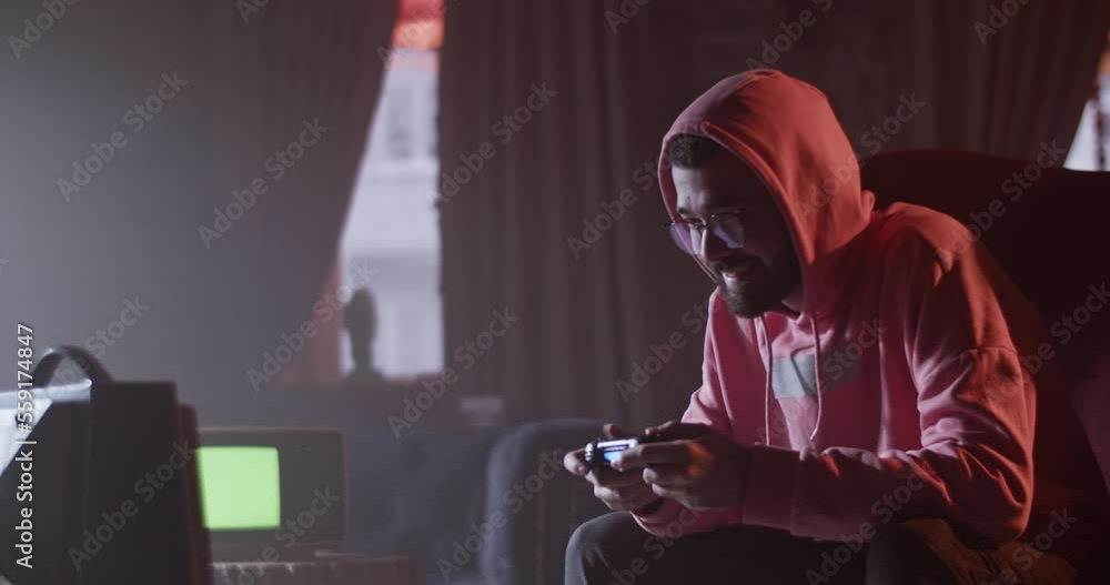 Challenging man playing videogame in cafe Challenging man playing videogame in cafe