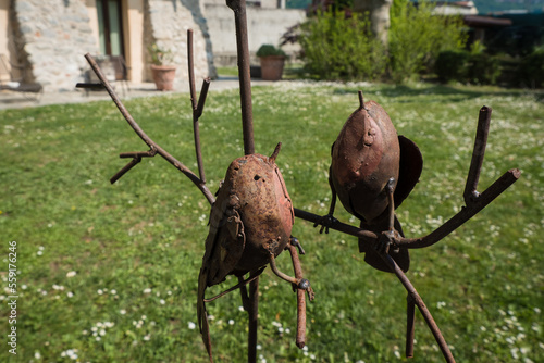 Cute birds crafted out of metal. Rusty sculpture. Iron garden decoration.