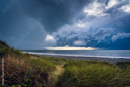 Fototapeta Naklejka Na Ścianę i Meble -  storm clouds over the sea, Dinas Dinlle, Wales
