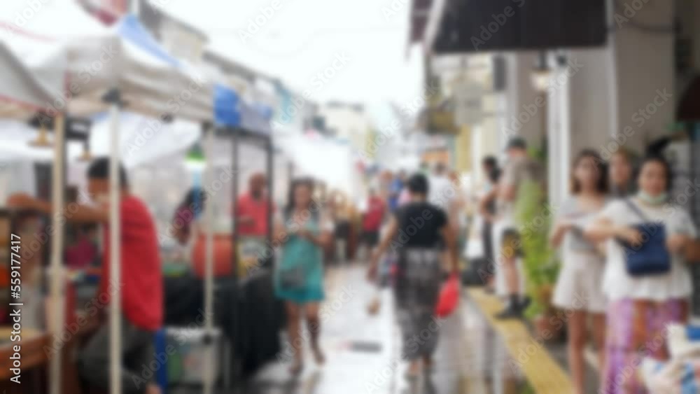Out of focus blurred of shoppers shopping in walking street through Asian street market in thalang road, old town, phuket thailand, background video Out of focus blurred of shoppers shopping in walking street through Asian street market in thalang road, old town, phuket thailand, background video