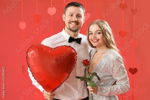 Happy young couple with hea...