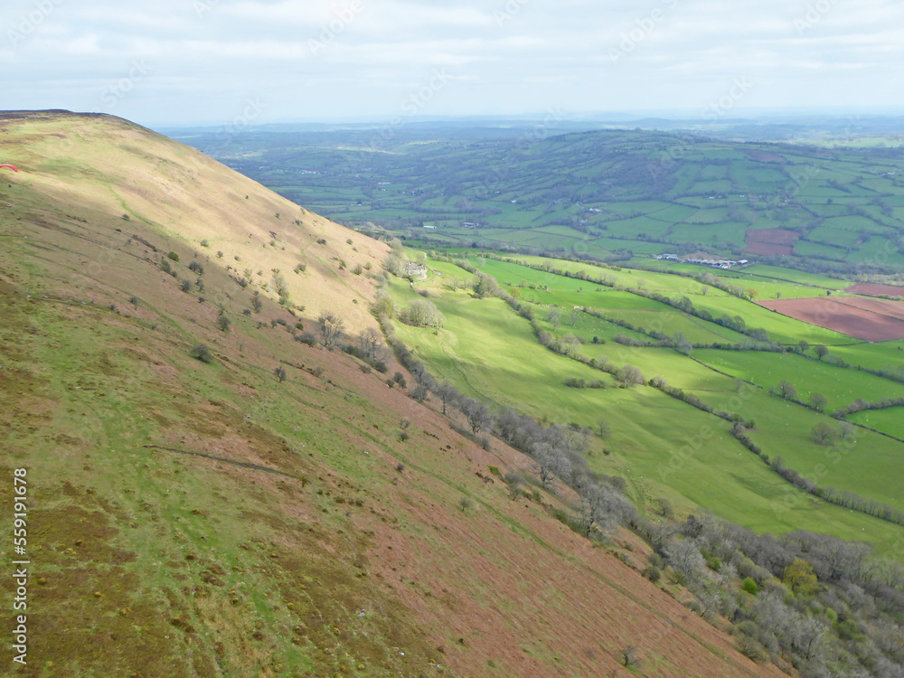 Paragliding above the ridge at Pandy, Wales	