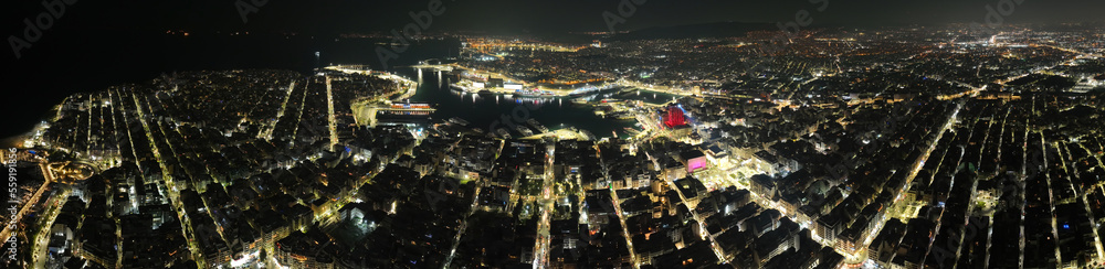Aerial drone night shot of illuminated tower and port of Piraeus during New Year's eve celebrations, Attica, Greece Aerial drone night shot of illuminated tower and port of Piraeus during New Year's eve celebrations, Attica, Greece