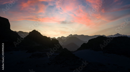 peaks of mountains in the desert against sunset © Sofiia