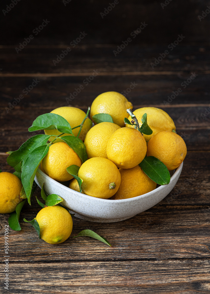 Fresh lemons in a bowl on the table
