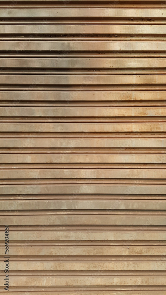 Textured pattern of rusty metal gate, brown in color, with horizontal lines. Textured pattern of rusty metal gate, brown in color, with horizontal lines.