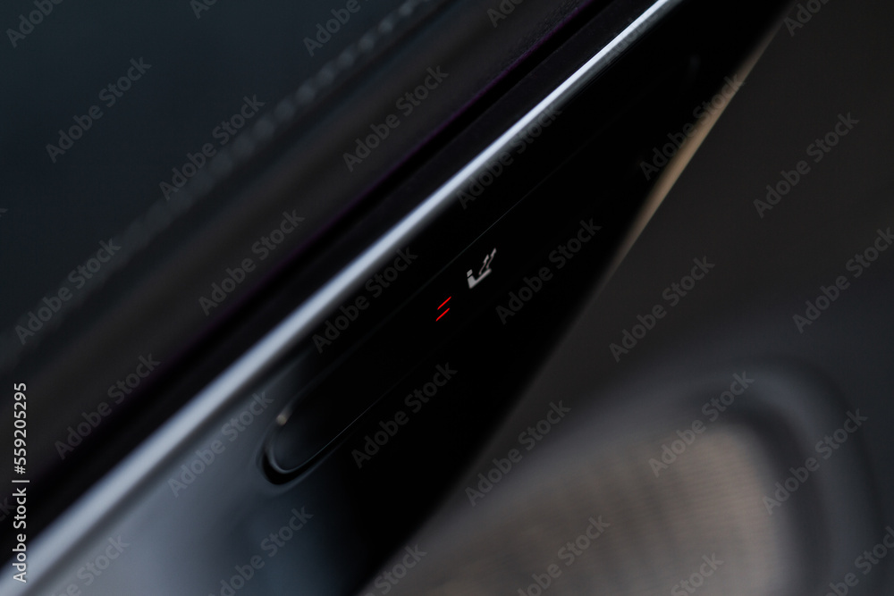 Seat heating controller buttons close up view. Car interior. Seat heater button, car interior. The heating mode is strong. Seat heating controller buttons close up view. Car interior. Seat heater button, car interior. The heating mode is strong.