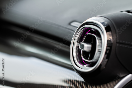 Car air conditioning close up view. The air conditioner flow inside the car. Detail interior of car. Air ducts. © Roman