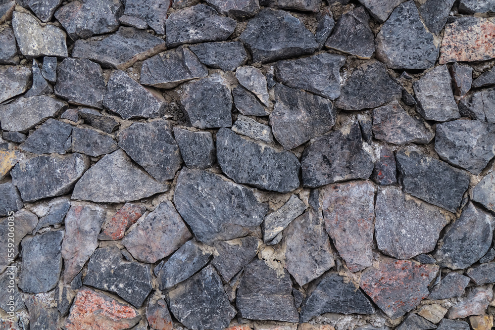 The texture of the stone wall. Old castle stone wall texture background. Stone wall as background or texture. Part of a stone wall for background or texture. The texture of the stone wall. Old castle stone wall texture background. Stone wall as background or texture. Part of a stone wall for background or texture.