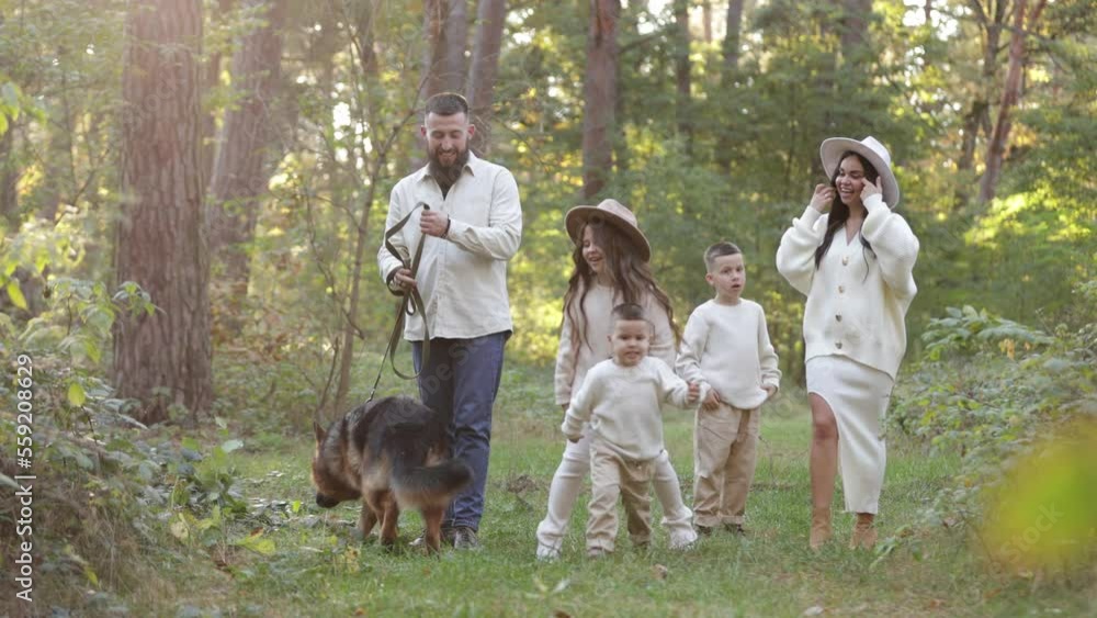 Happy playful family runing in park with pet. Young mom, dad having fun with three kids and big dog outdoors. Parents with children holding hands. Active lifestyle parenthood concept. Happy childhood Happy playful family runing in park with pet. Young mom, dad having fun with three kids and big dog outdoors. Parents with children holding hands. Active lifestyle parenthood concept. Happy childhood