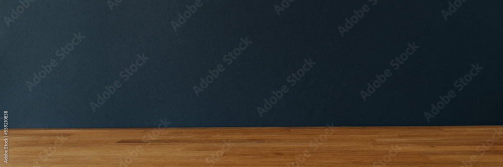 Banner with dark blue background for copy space and wooden table Banner with dark blue background for copy space and wooden table