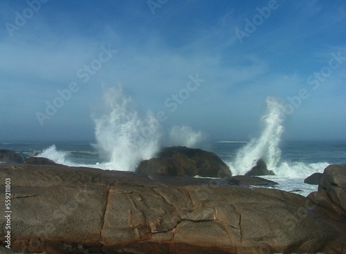 wave crashing over rocks
