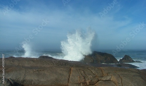 wave crashing over rocks