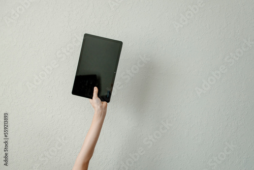 a child learns on a tablet online