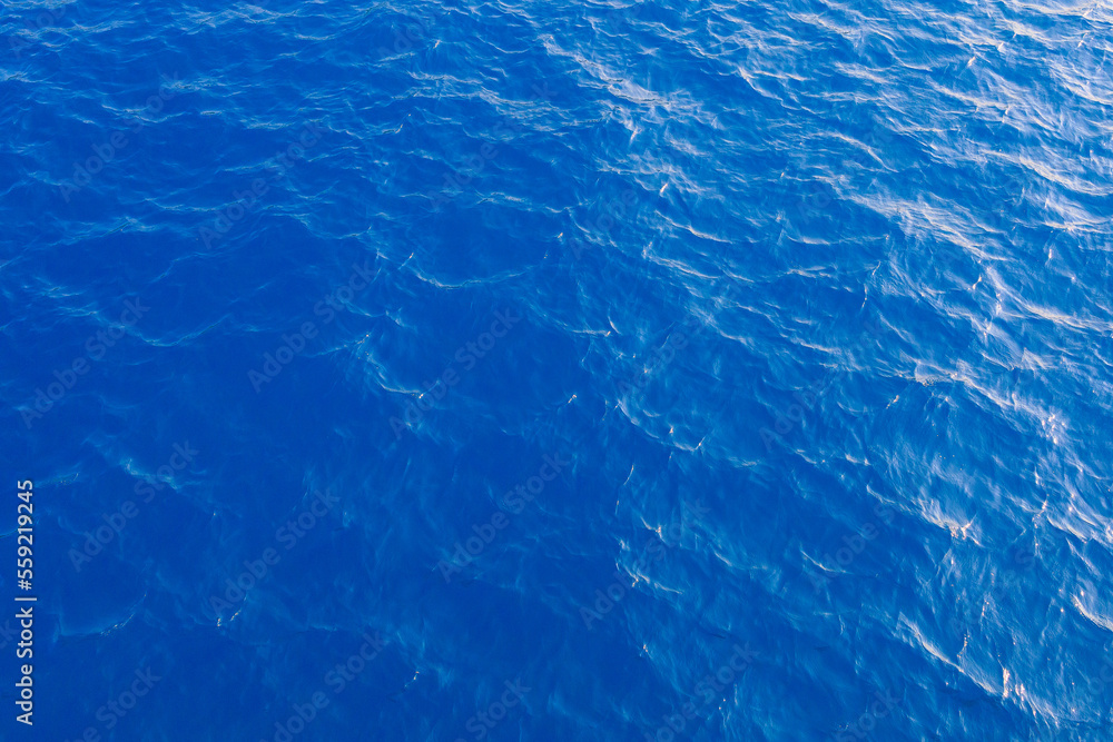 Very nice sea water background or backdrop with selective focus. Small waves of natural water surface texture. Very nice sea water background or backdrop with selective focus. Small waves of natural water surface texture.