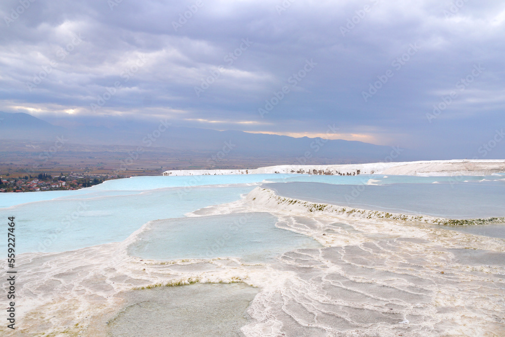 Panorama of Pamukkale, white stone terraces with thermal blue water Panorama of Pamukkale, white stone terraces with thermal blue water