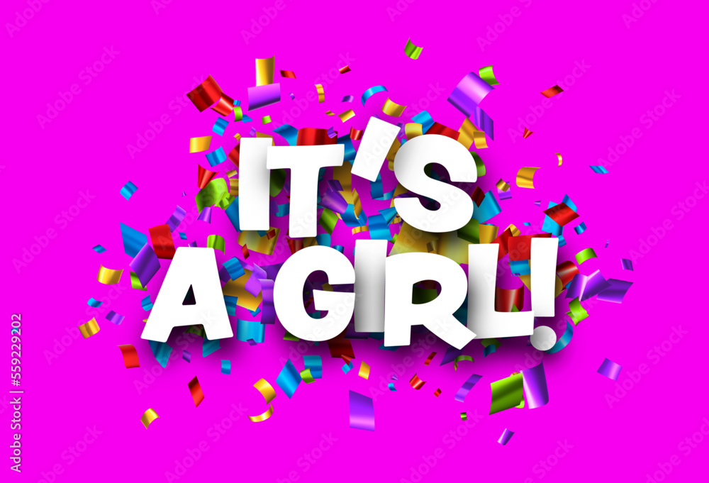 It's a girl sign over foil colorful cut out ribbon confetti background. It's a girl sign over foil colorful cut out ribbon confetti background.