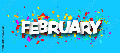 February word over colorful cut out ribbon confetti background.