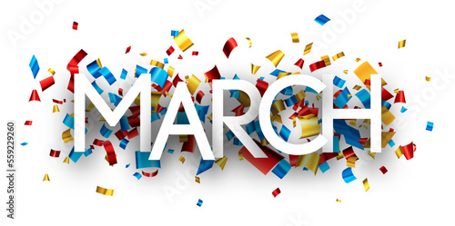 March word over colorful cut out foil ribbon confetti background.