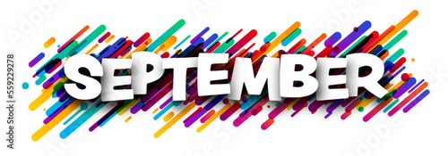 September word over colorful brush strokes background.