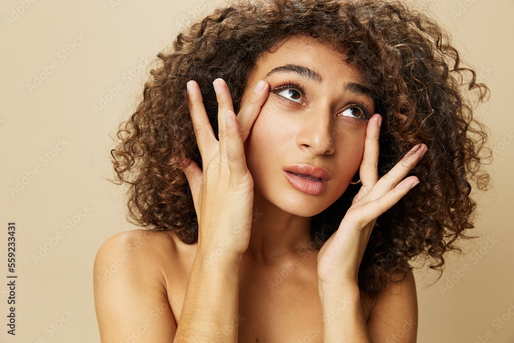 Obraz premium Woman beauty face close-up skin health nails and hair, hair dryer style curly afro hair, body and beauty care concept