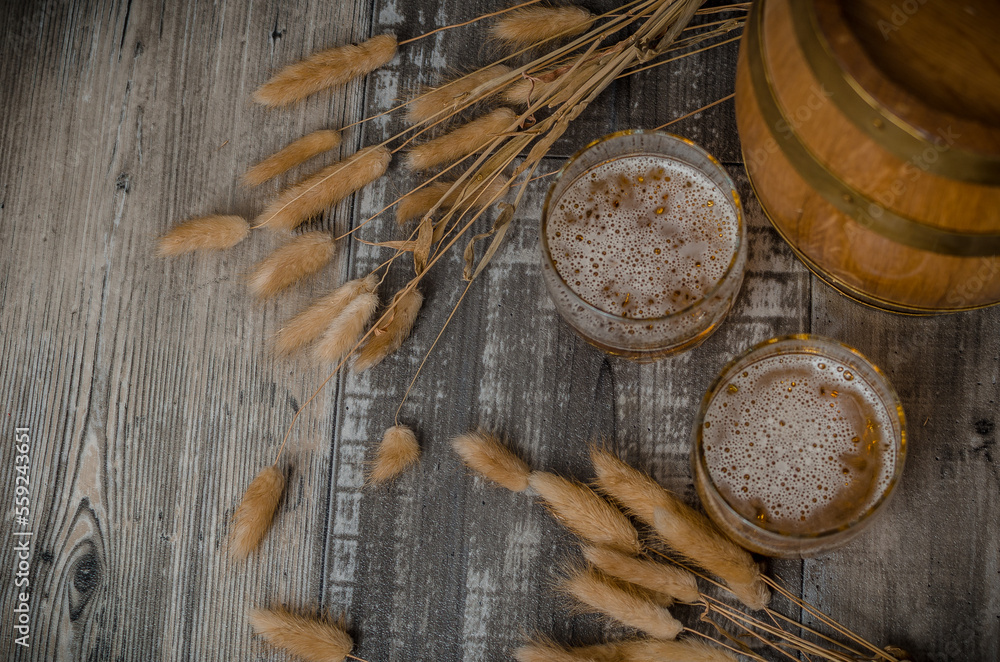 very cold craft beer pint on barrel with black bacground very cold craft beer pint on barrel with black bacground