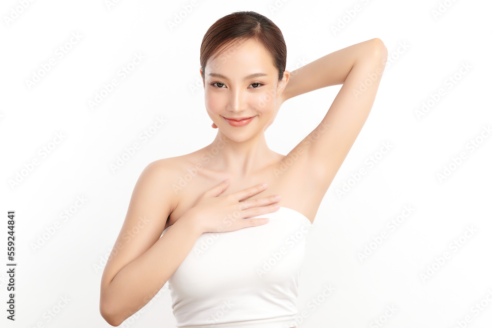 Beautiful Young Asian woman lifting hands up to show off clean and hygienic armpits or underarms on white background, Smooth armpit cleanliness and protection concept Beautiful Young Asian woman lifting hands up to show off clean and hygienic armpits or underarms on white background, Smooth armpit cleanliness and protection concept