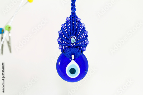 pendant on chain, nazar beads against the evil eye photo