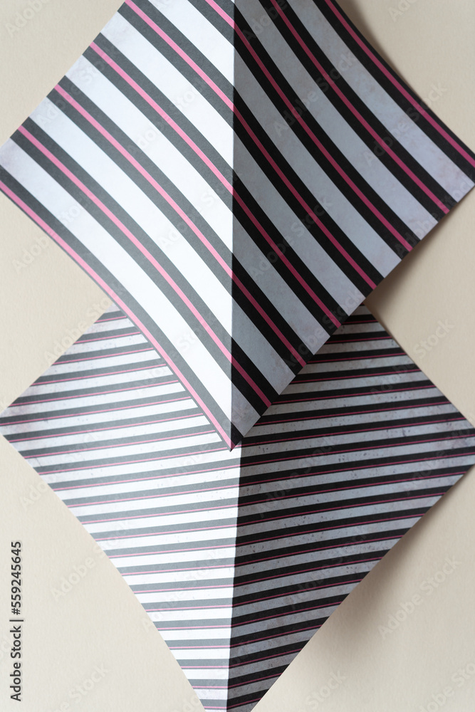 Fototapeta premium folded scrapbook paper sheets with stripe patterns