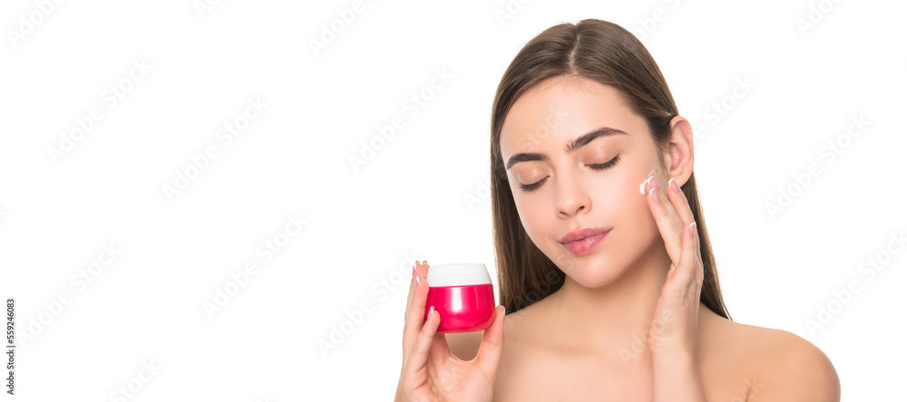 Woman beauty face, close up portrait, isolated banner with copy space. cleansing scrub. presenting female cosmetic product. woman applying face cream. Woman beauty face, close up portrait, isolated banner with copy space. cleansing scrub. presenting female cosmetic product. woman applying face cream.