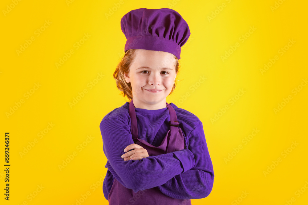 Kid chef cook, studio portrait. Children cooking. Kid boy with apron and chef hat. Kid chef cook, studio portrait. Children cooking. Kid boy with apron and chef hat.