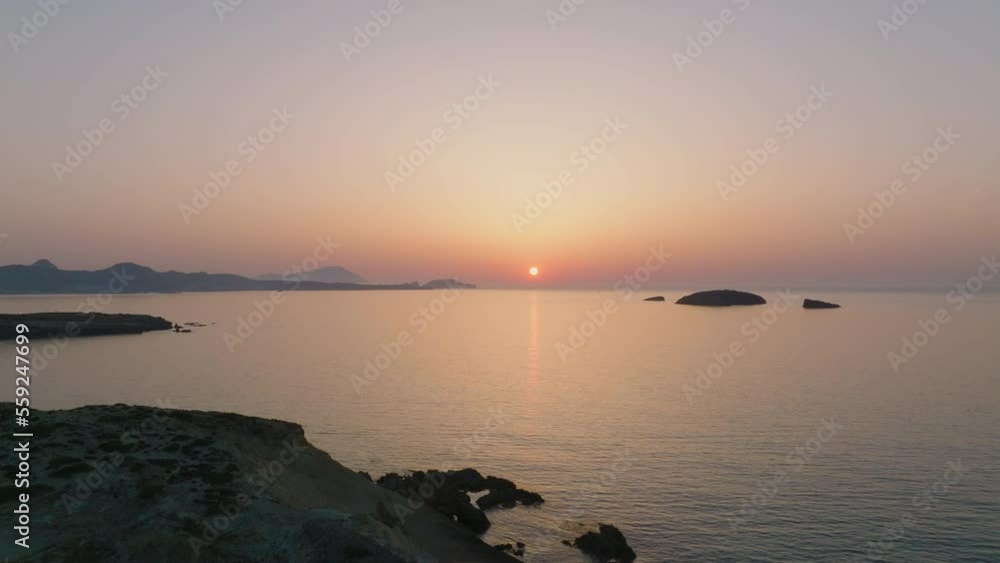 Aerial of the sunset seen from Milos Island, Greece Aerial of the sunset seen from Milos Island, Greece