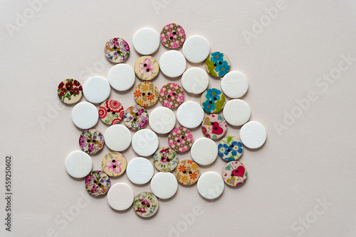 set of decorative wood buttons and wooden circle shapes on paper