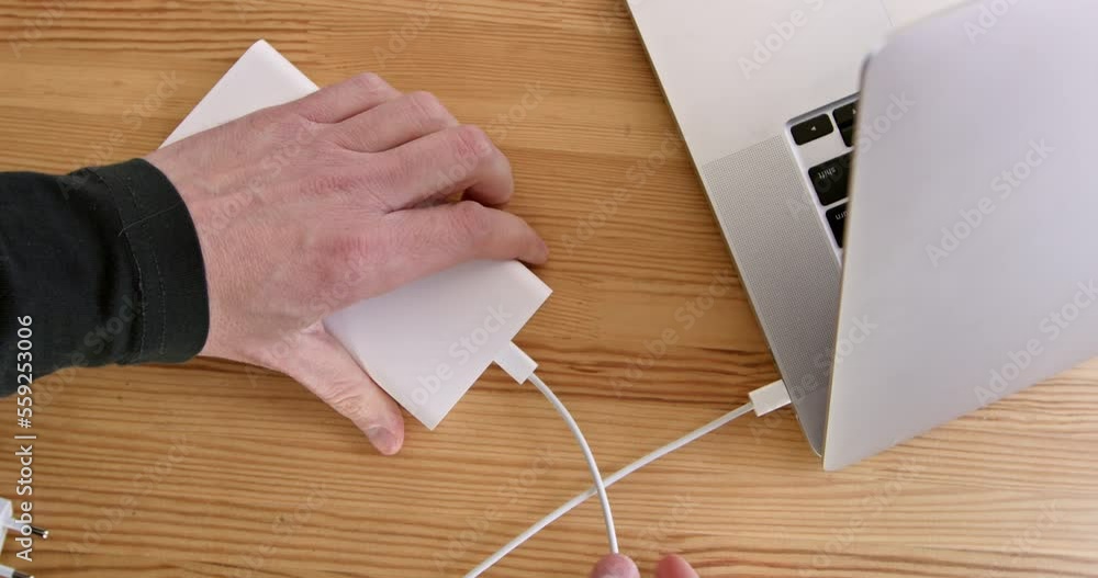 Unplug the power cord from the outlet and connect the charged drive to