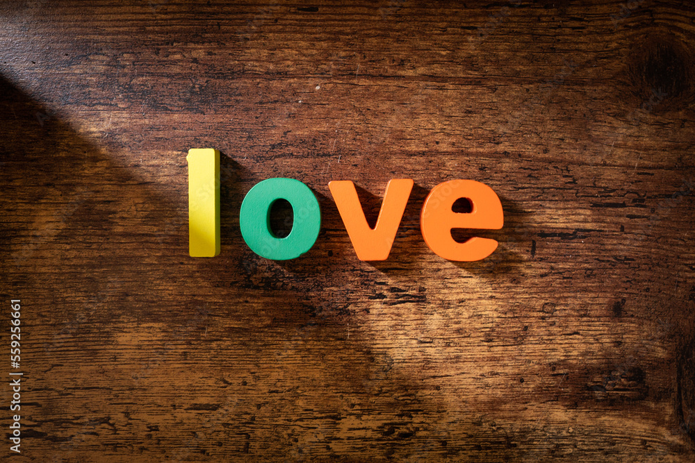 Word love, written with colour wood material Word love, written with colour wood material