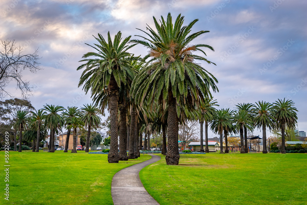 Walking path through the Edwards Park in Port Melbourne, Australia Walking path through the Edwards Park in Port Melbourne, Australia