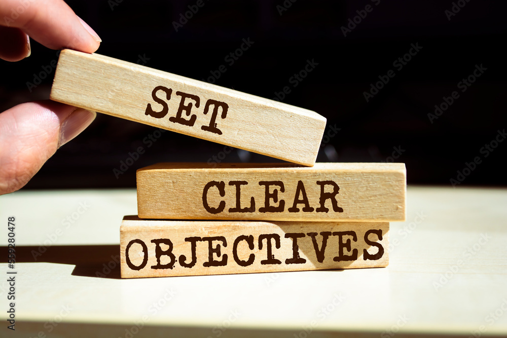 Wooden blocks with words 'SET CLEAR OBJECTIVES'. Wooden blocks with words 'SET CLEAR OBJECTIVES'.