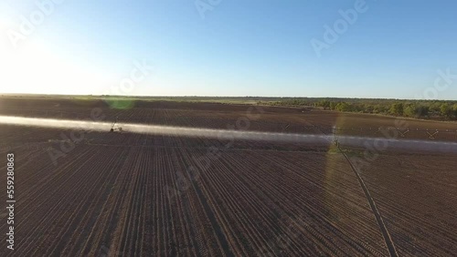 Aerial view of irrigation pivots with sprinklers spraying water on the crops photo