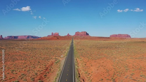 Drone shot of highway towards Monument Valley on a sunny day. Aerial view of US State Route 163 in Utah America.