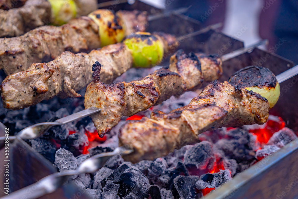 Russian style shashlik (kebab) prepared on charcoal smoke Russian style shashlik (kebab) prepared on charcoal smoke