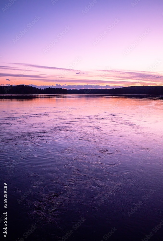 Sunset over Damariscotta River, Maine. Damariscotta is known as the Oyster Capital of New England. Vertical. Copy Space.