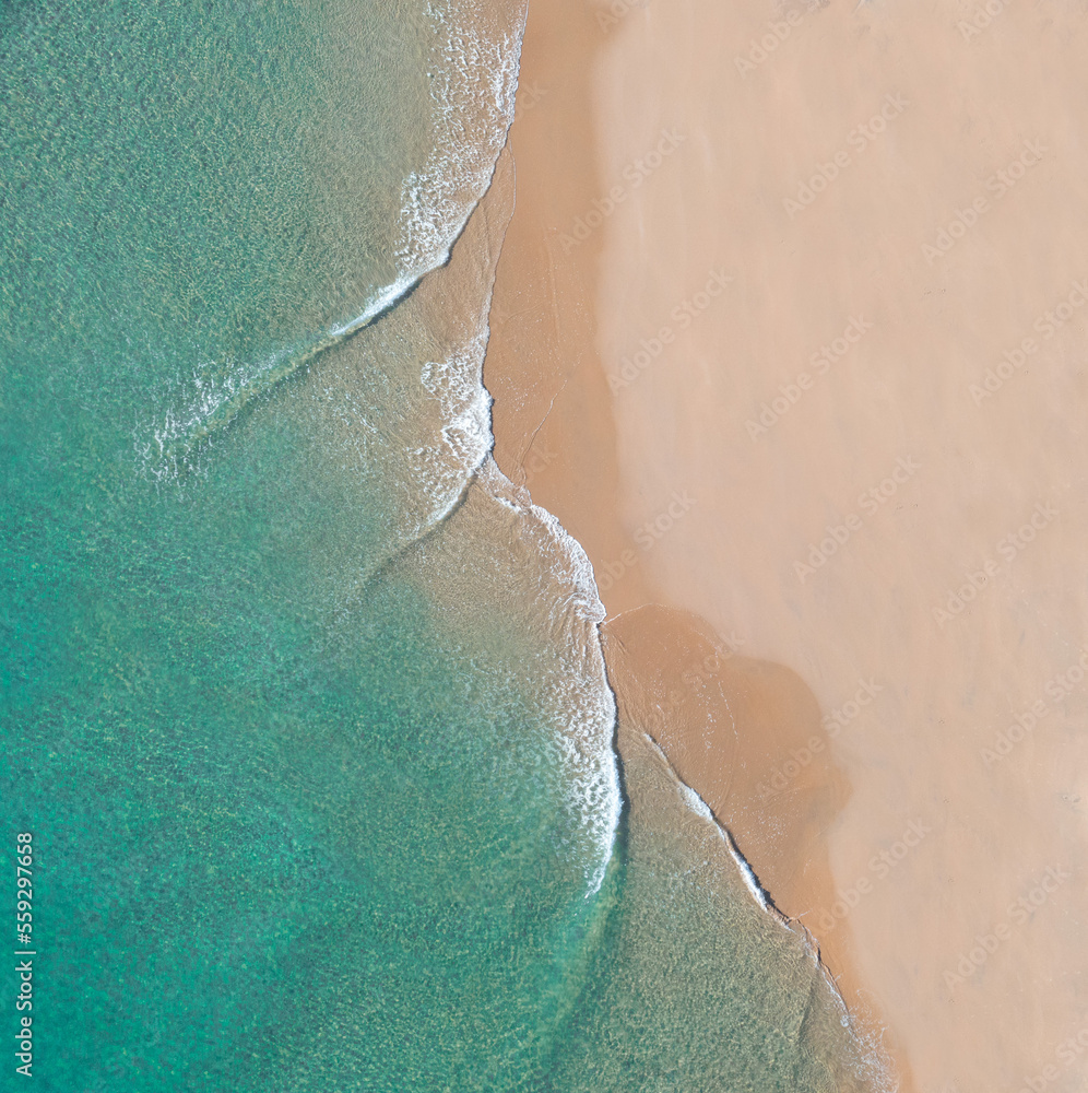 Aerial view of a beach with calm smooth waves on the Gold Coast