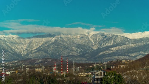 Time-lapse of overcast sky against the background of mountains, clouds fly quickly
