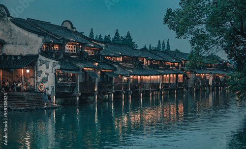 Night scenes of townhouses lining along the river in Wuzhen Village photo