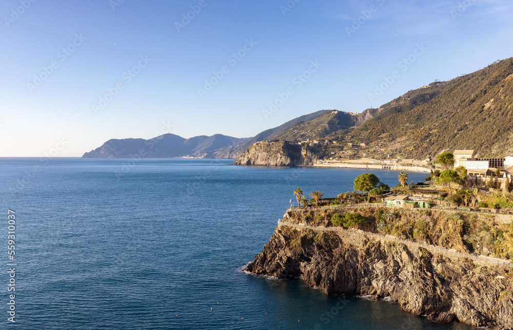Small touristic town on the coast, Manarola, Italy. Cinque Terre. Sunny Fall Season day.
