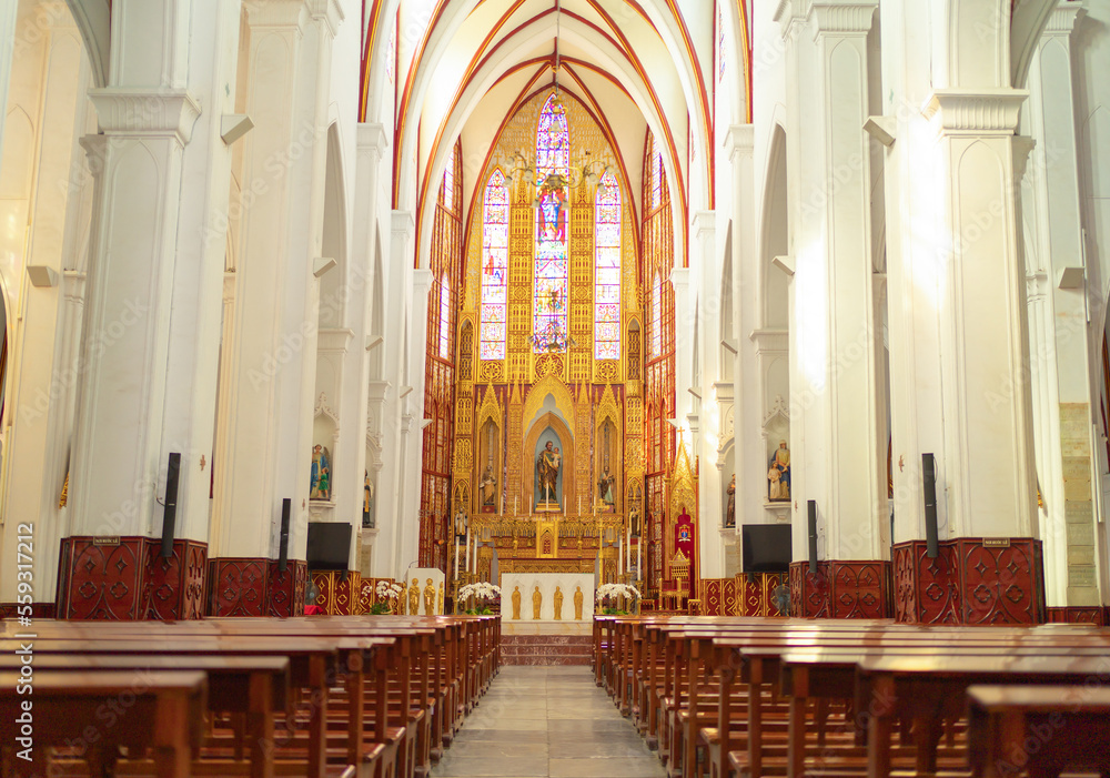 Interior of empty christian church with cross, architecture design. Religious beliefs. Catholic religion. Jesus worship.