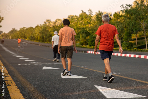 Senior people exercise walking at public park healthy lifestyle concept.