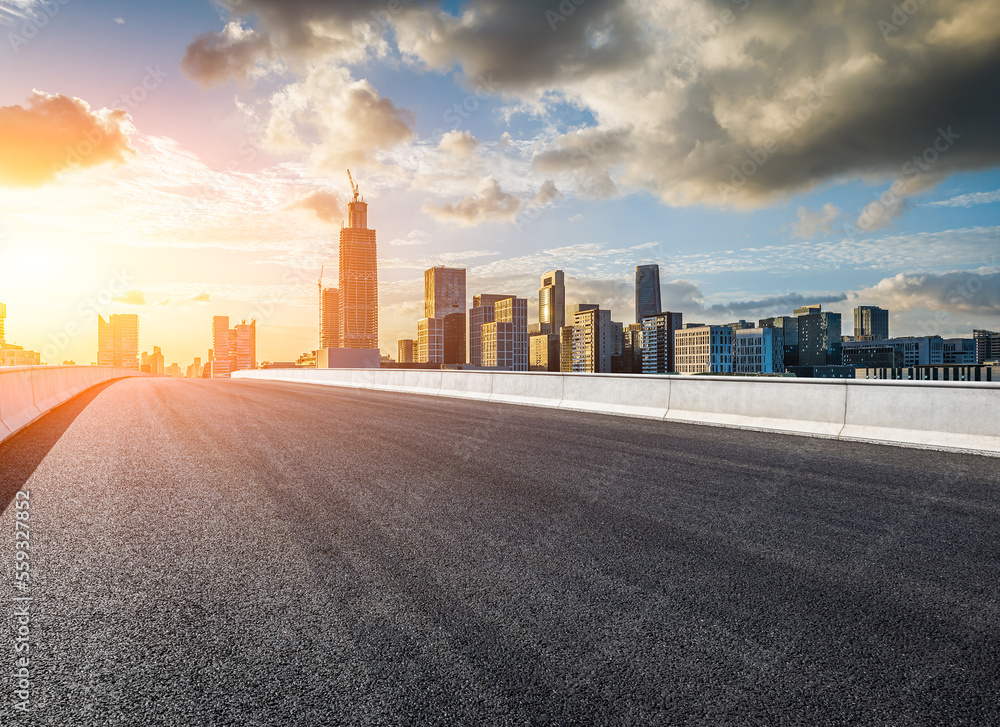 Asphalt road and modern city skyline with buildings in Ningbo, Zhejiang Province, China. Asphalt road and modern city skyline with buildings in Ningbo, Zhejiang Province, China.